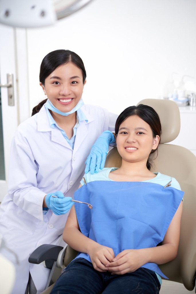 Dentist preparing a patient for Dental Sealants