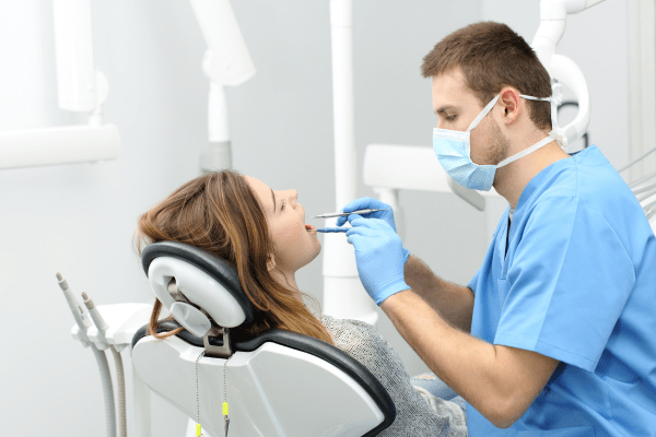 Dentist Aesthetic Smile realigning with a patient